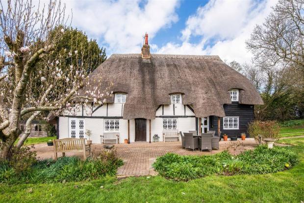 Beautiful thatched cottage with swimming pool up for sale for £1.25 million