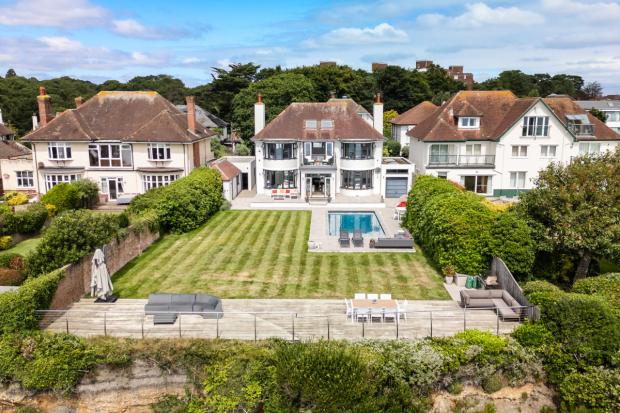 Clifftop home with panoramic views and direct sandy beach access